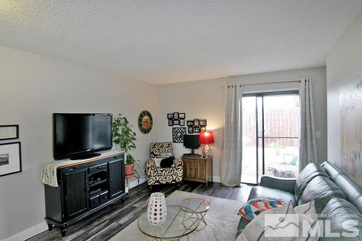 4985 West 7th Street, Unit 10 Reno, NV 89503 - Photo 7 of 20 a living room with furniture and a flat screen tv