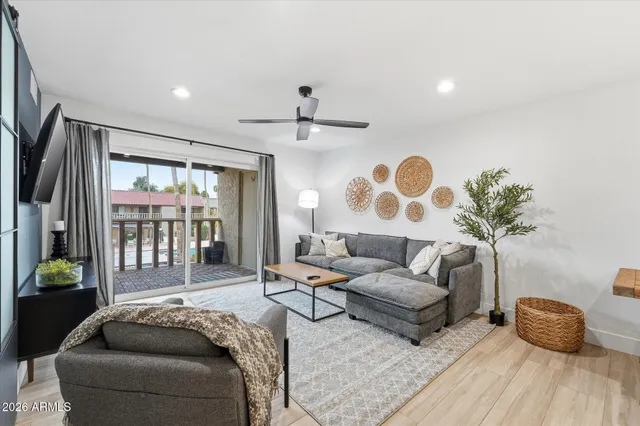 a living room with furniture and a large window
