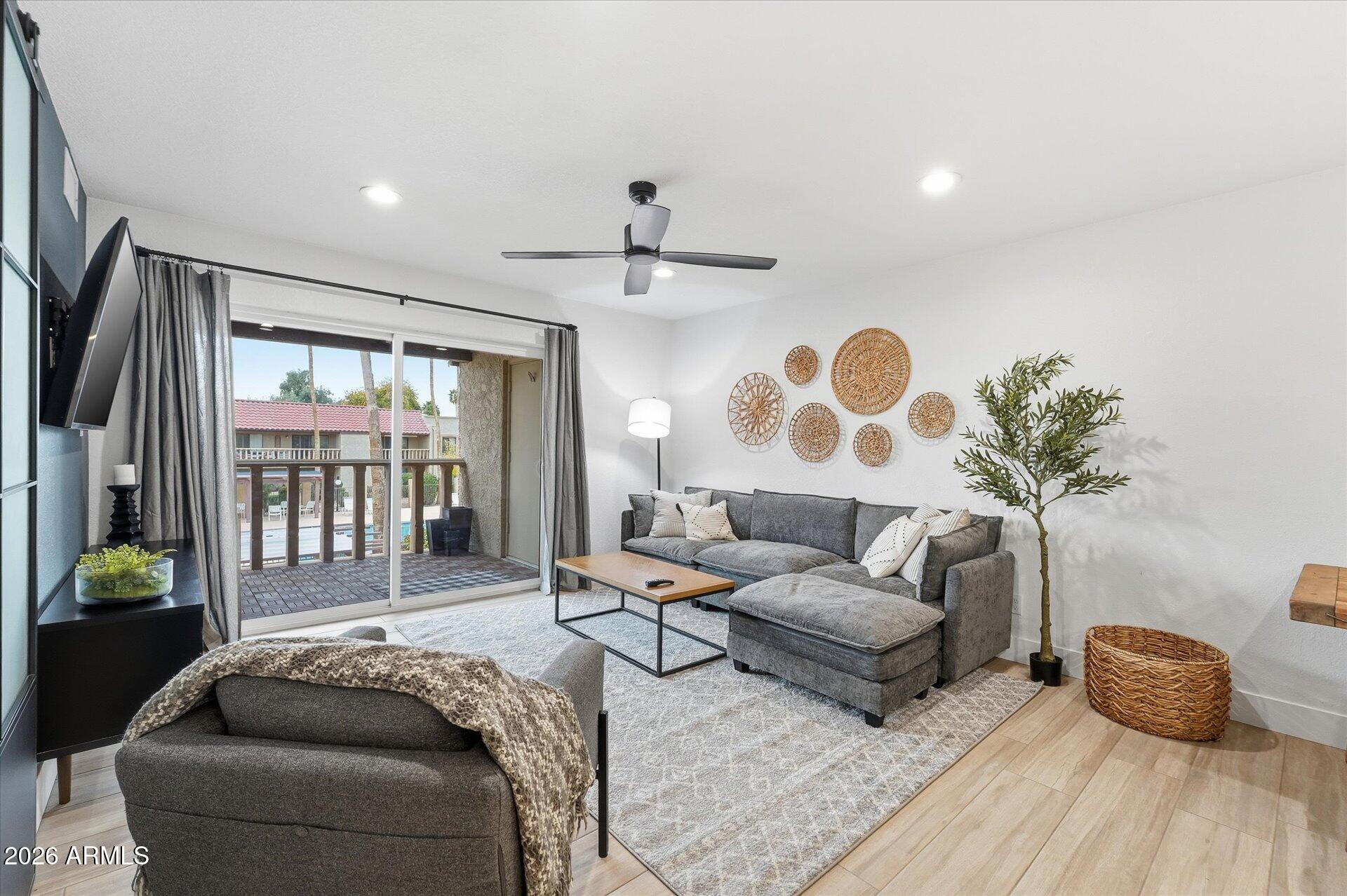 a living room with furniture and a large window