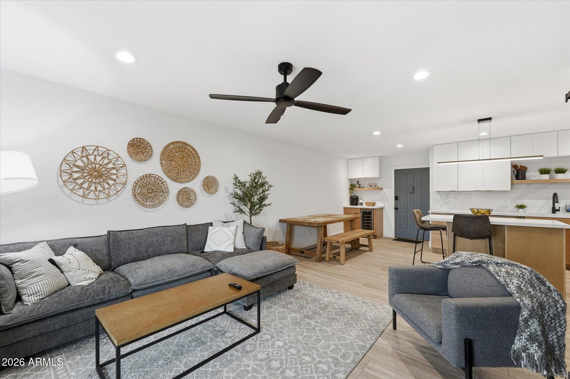 8649 East Royal Palm Road, Unit 239 Scottsdale, AZ 85258 - Photo 14 of 34 a living room with furniture and a view of kitchen
