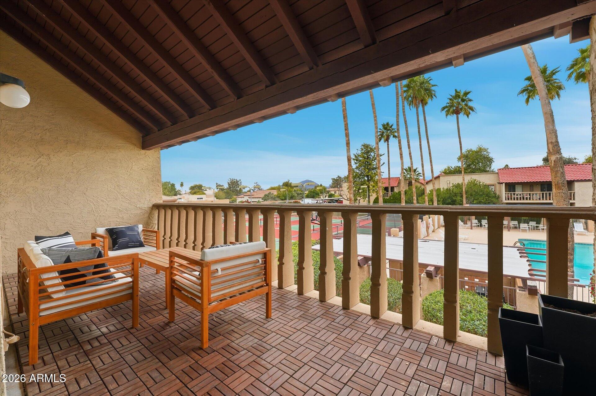 8649 East Royal Palm Road, Unit 239 Scottsdale, AZ 85258 - Photo 16 of 34 a view of a chairs and table in patio with a grill