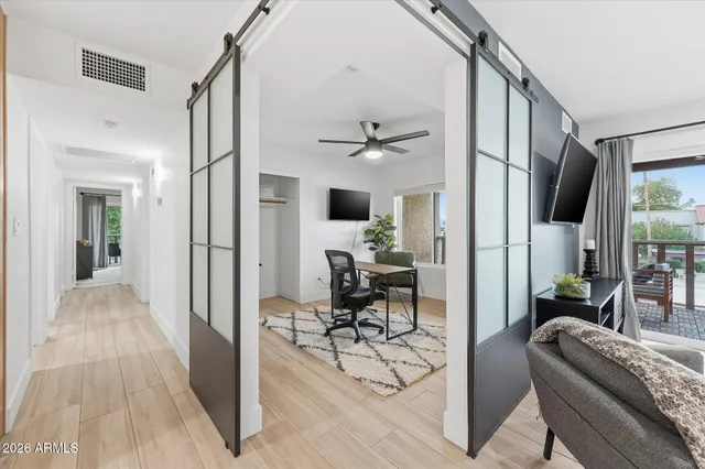 a view of a livingroom with furniture and a potted plant