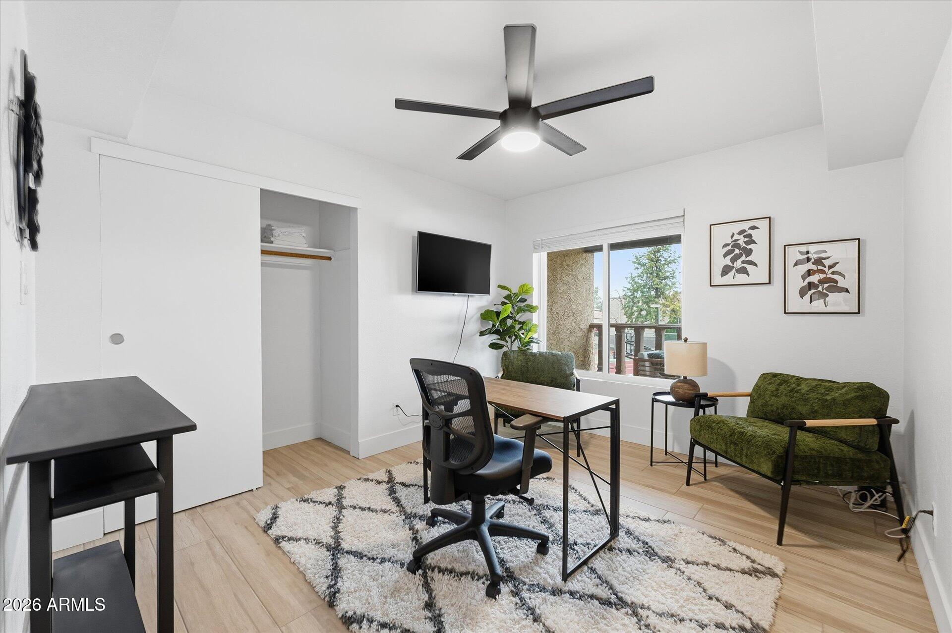 8649 East Royal Palm Road, Unit 239 Scottsdale, AZ 85258 - Photo 18 of 34 a view of a livingroom with furniture and a potted plant