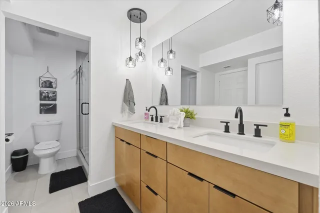 a bathroom with a shower a toilet and a shower