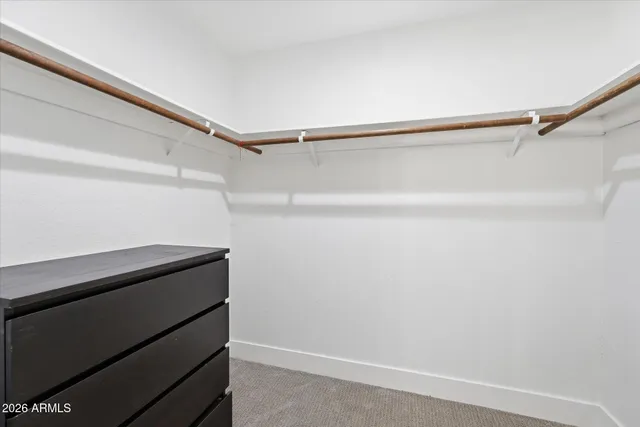a view of a balcony with wooden floor and outdoor seating