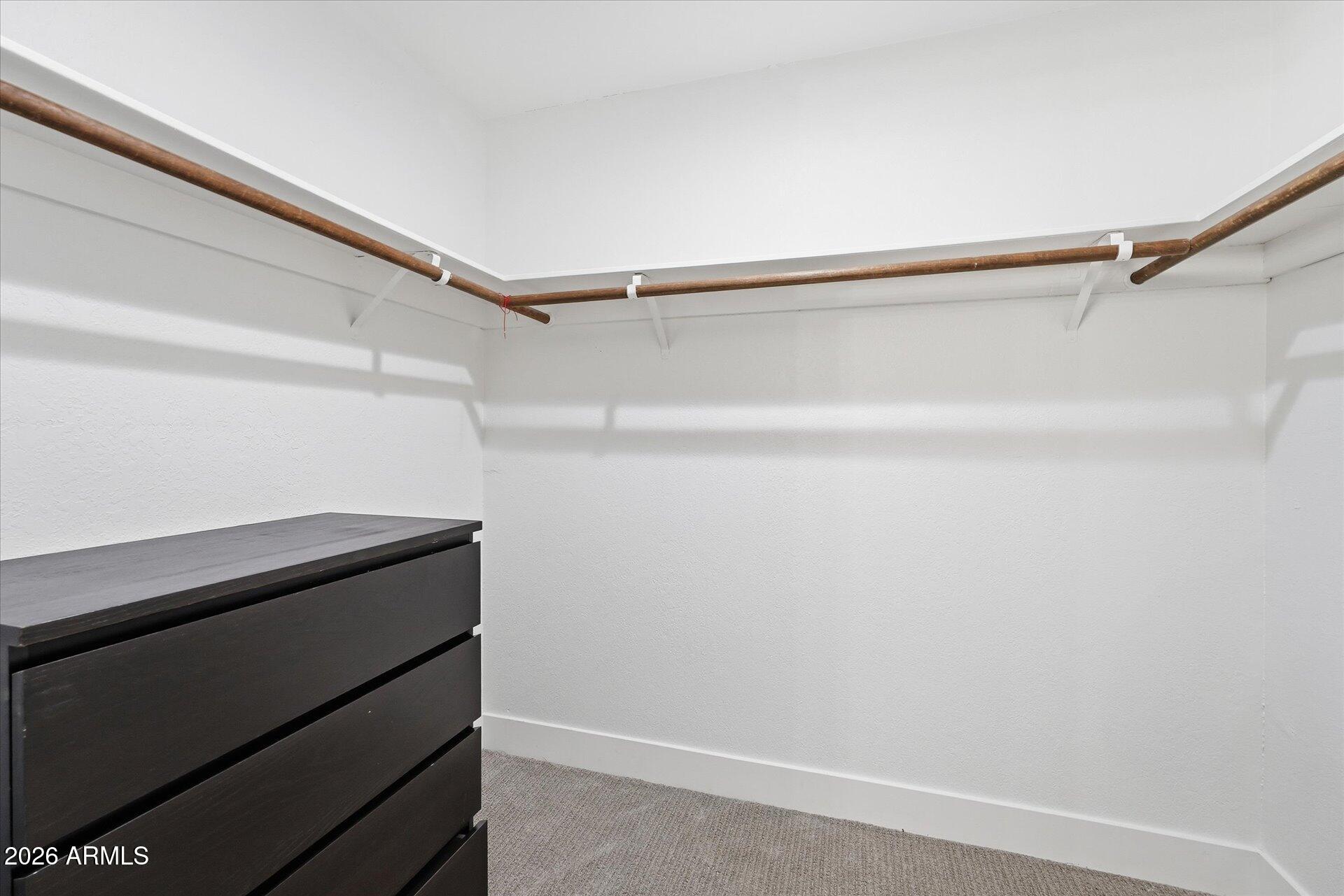 8649 East Royal Palm Road, Unit 239 Scottsdale, AZ 85258 - Photo 25 of 34 a view of an empty walk in closet