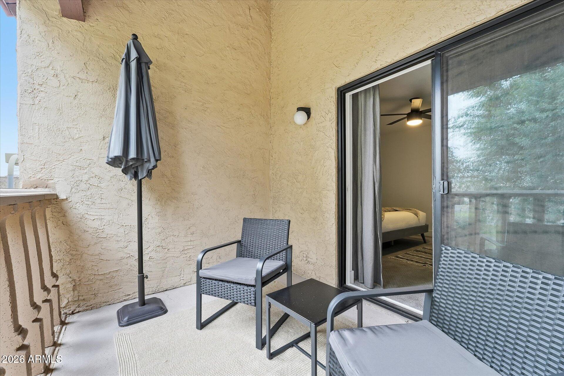 8649 East Royal Palm Road, Unit 239 Scottsdale, AZ 85258 - Photo 27 of 34 a view of a livingroom with furniture and front door