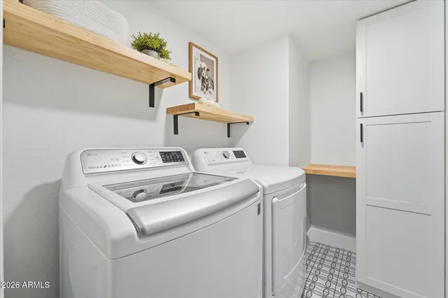 a building view with swimming pool and lawn chairs
