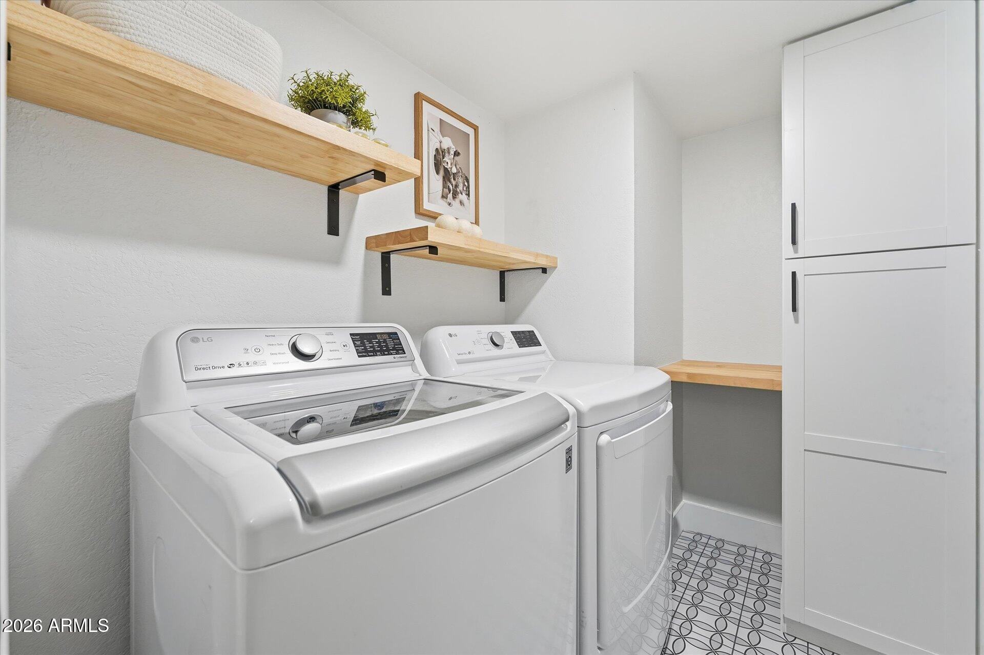 8649 East Royal Palm Road, Unit 239 Scottsdale, AZ 85258 - Photo 31 of 34 a utility room with dryer and washer
