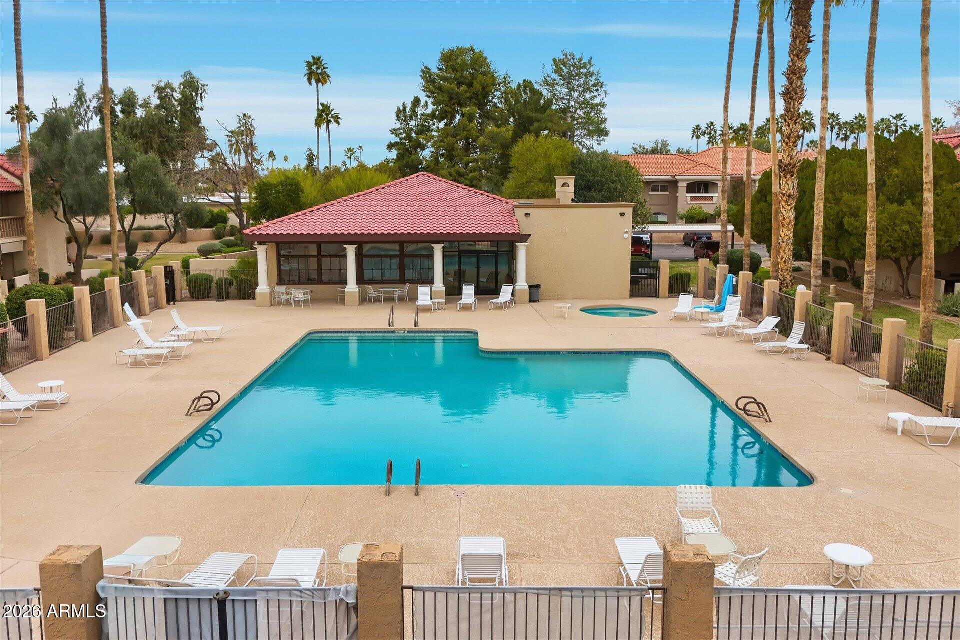 8649 East Royal Palm Road, Unit 239 Scottsdale, AZ 85258 - Photo 33 of 34 a view of swimming pool with outdoor seating