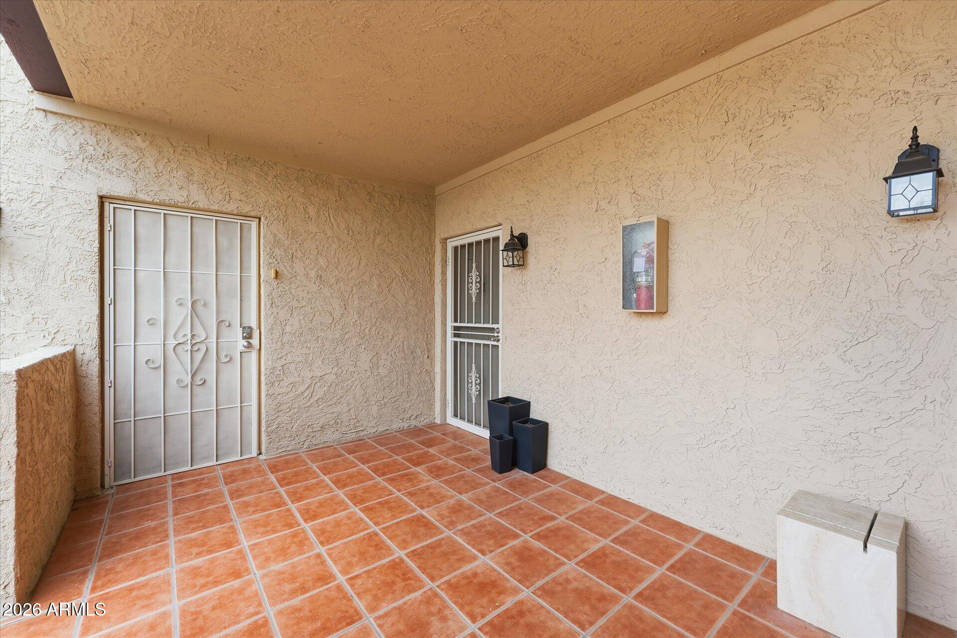 8649 East Royal Palm Road, Unit 239 Scottsdale, AZ 85258 - Photo 5 of 34 a bedroom with a bed and a shower