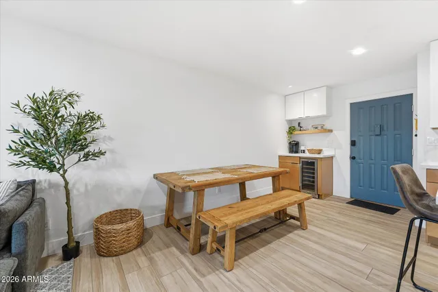 a bedroom with a bed and a potted plant