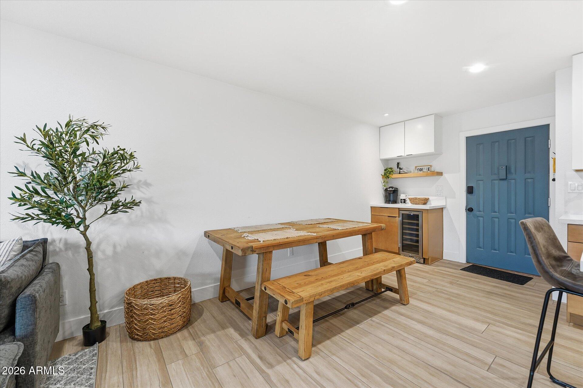 8649 East Royal Palm Road, Unit 239 Scottsdale, AZ 85258 - Photo 10 of 34 a living room with furniture and a potted plant