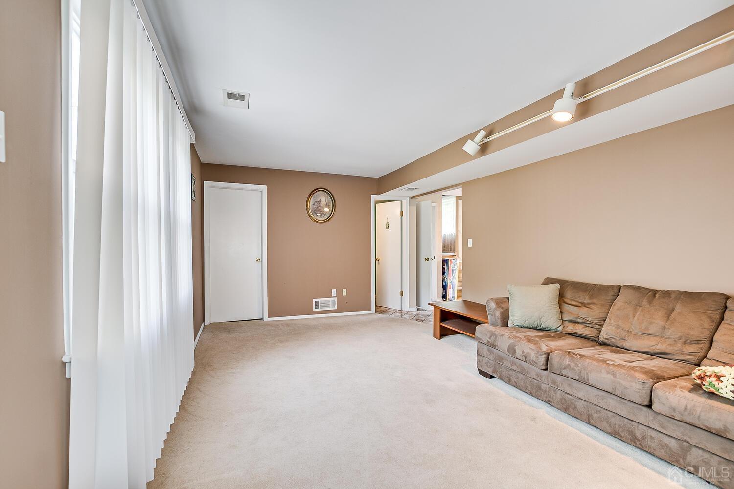 2 Julie Drive Edison, NJ 08820 - Photo 17 of 34 a living room with furniture and a window