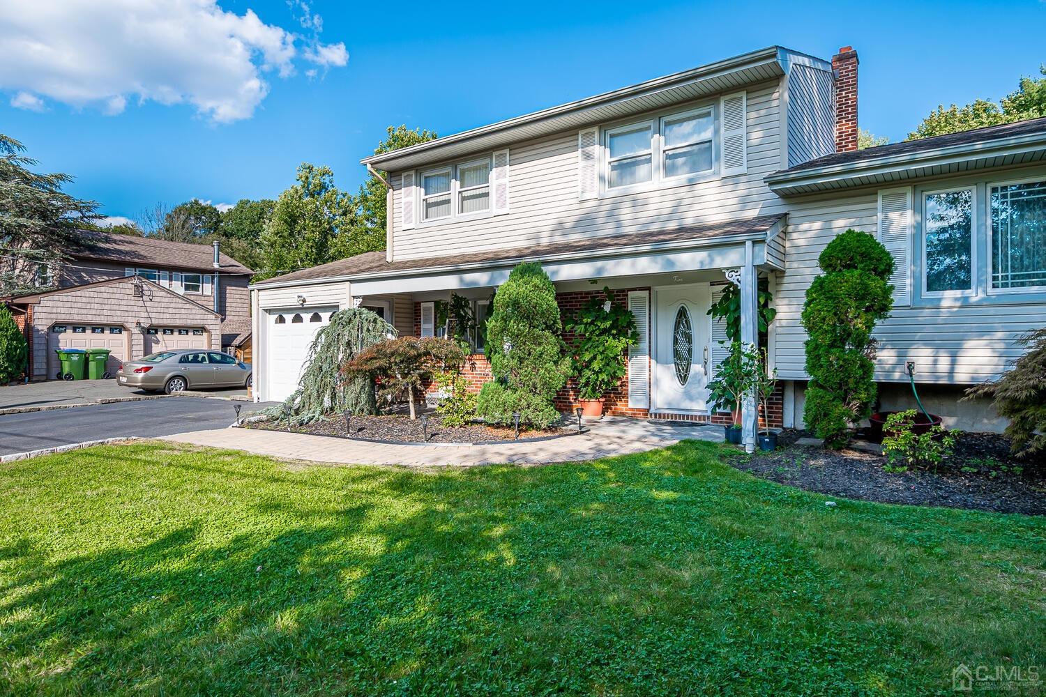 2 Julie Drive Edison, NJ 08820 - Photo 2 of 34 a view of a house with a yard porch and sitting area