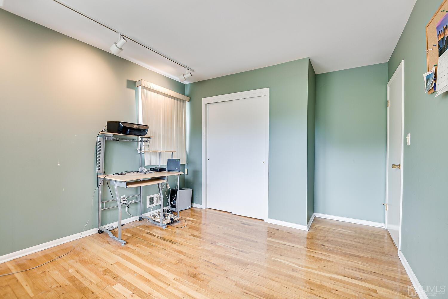 2 Julie Drive Edison, NJ 08820 - Photo 23 of 34 a room with a bed and a table in it