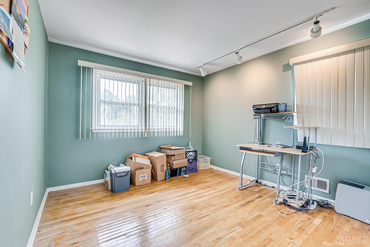 2 Julie Drive Edison, NJ 08820 - Photo 24 of 34 a room with a bed and a table in it