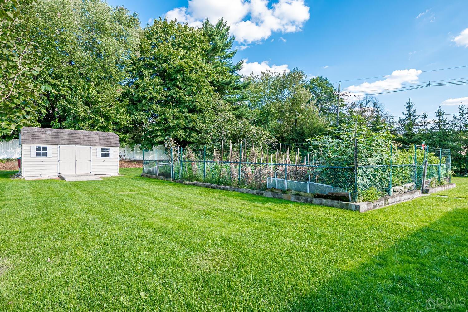 2 Julie Drive Edison, NJ 08820 - Photo 28 of 34 a view of a backyard with a garden and entertaining space