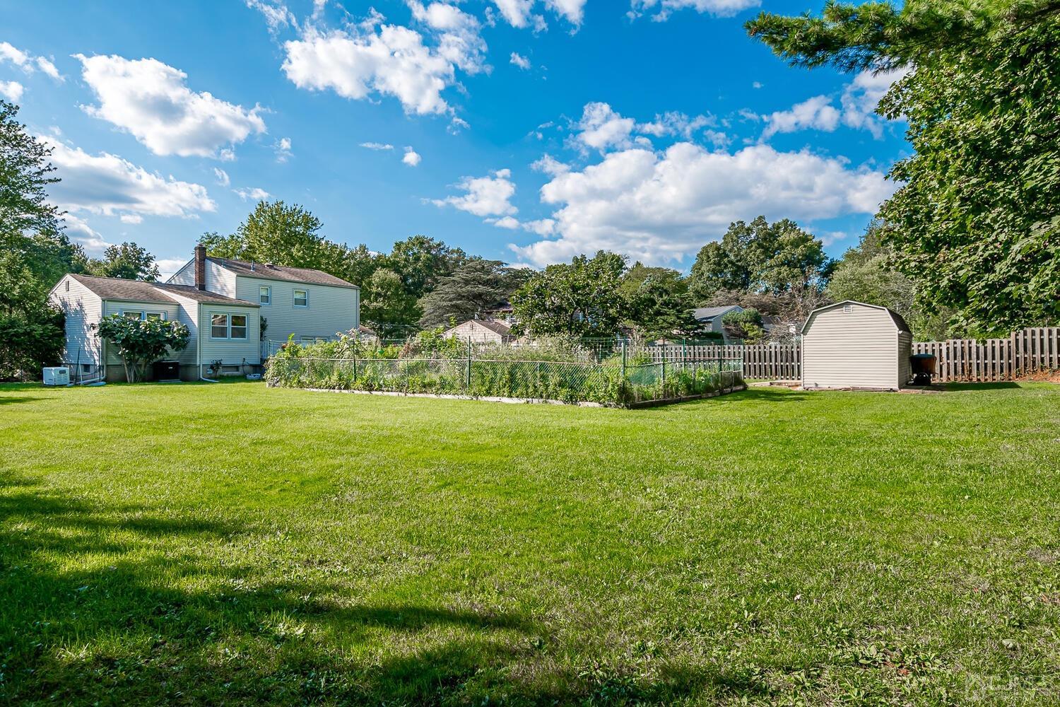 2 Julie Drive Edison, NJ 08820 - Photo 29 of 34 a view of a house with a garden