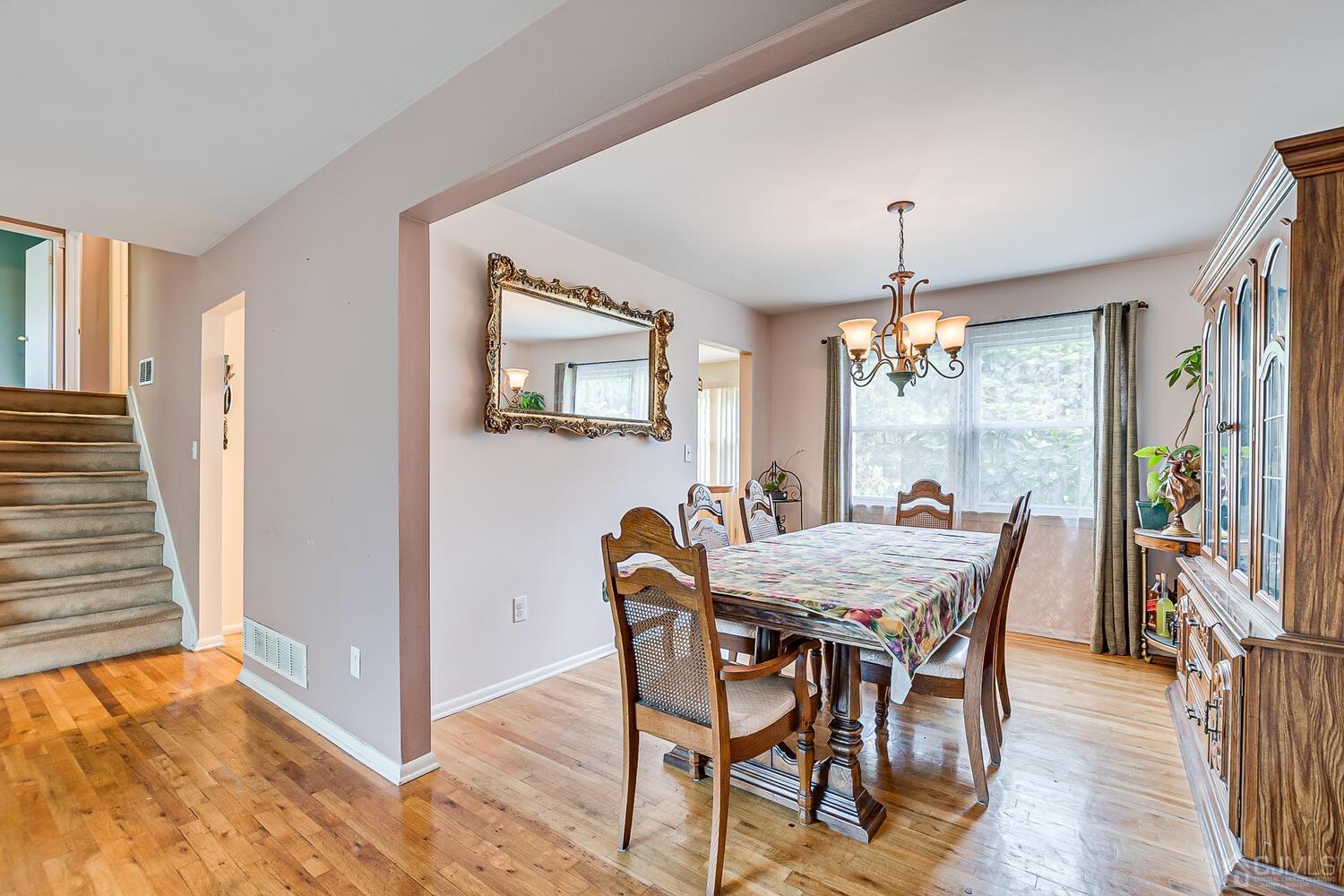 2 Julie Drive Edison, NJ 08820 - Photo 7 of 34 a view of a dining room with furniture window and wooden floor