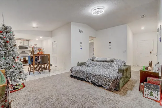 a living room with furniture and a table