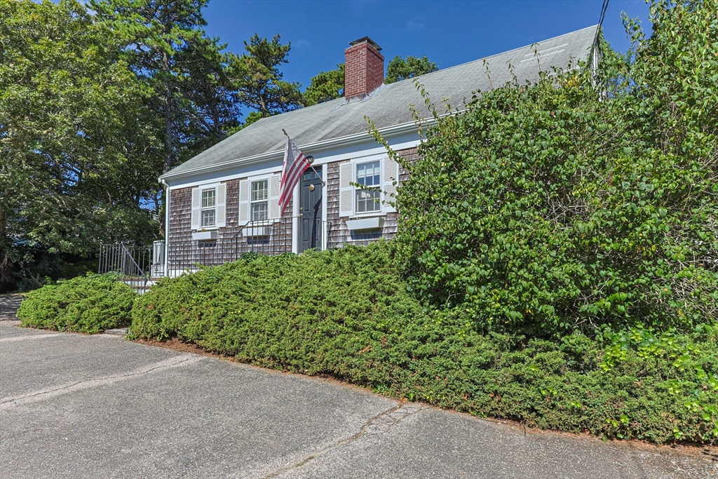 200 Hardings Beach Road Chatham, MA 02633 - Photo 1 of 24 a view of a house with a yard