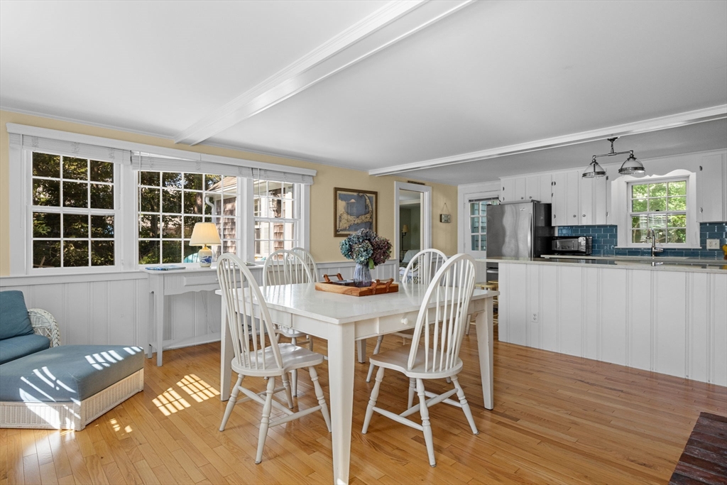 200 Hardings Beach Road Chatham, MA 02633 - Photo 7 of 24 a view of a dining room with furniture and wooden floor
