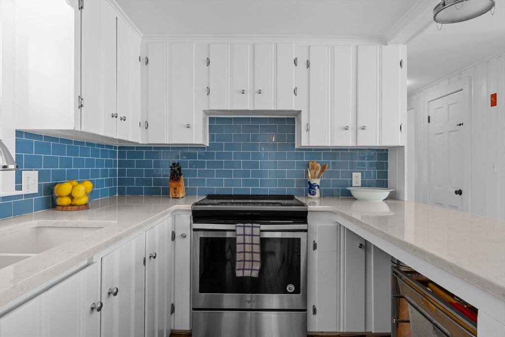 200 Hardings Beach Road Chatham, MA 02633 - Photo 10 of 24 a kitchen with a sink and cabinets