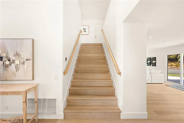 a kitchen that has a sink and a stove in it