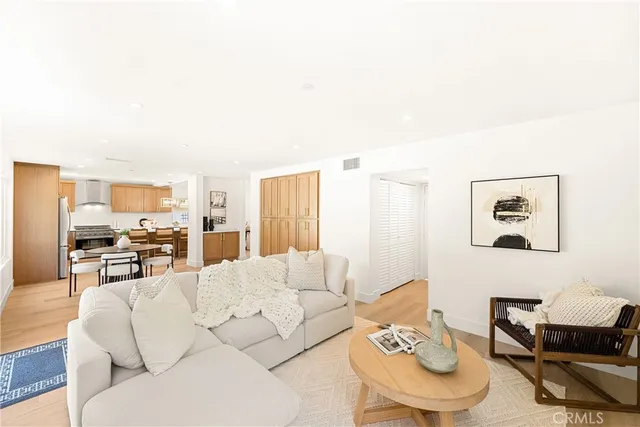 a bathroom with a toilet a sink a mirror and vanity