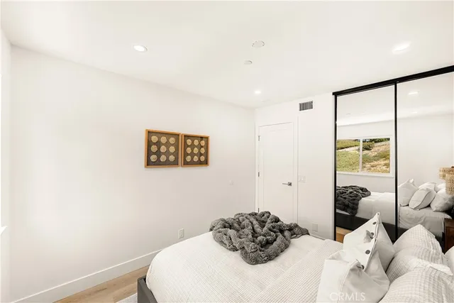 a view of a workspace with table and a potted plant
