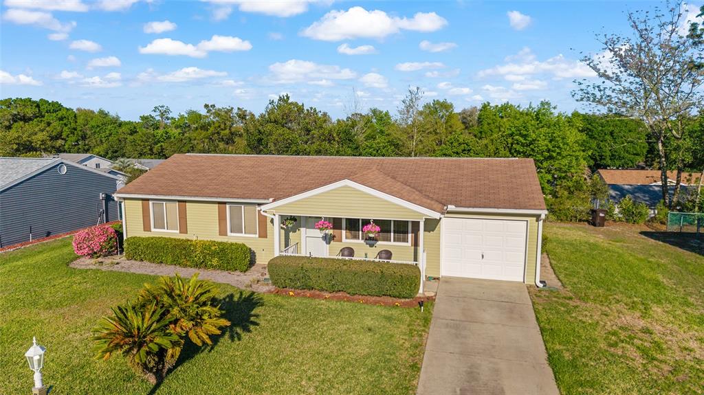 10921 Southwest 86th Court Ocala, FL 34481 - Photo 15 of 51 a front view of a house with garden