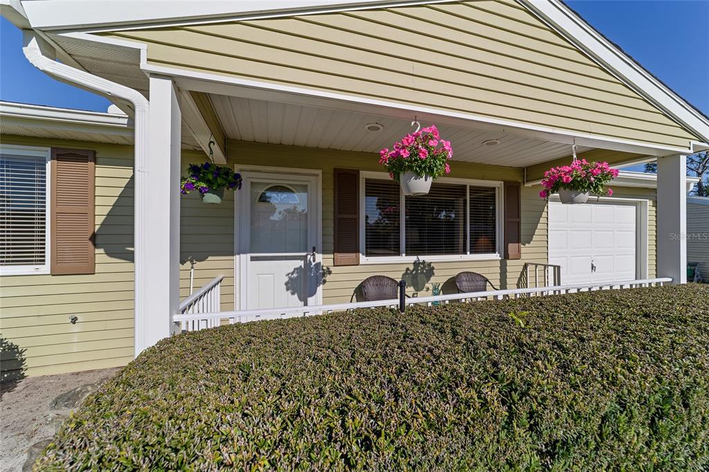 10921 Southwest 86th Court Ocala, FL 34481 - Photo 35 of 51 a front view of a house with a porch