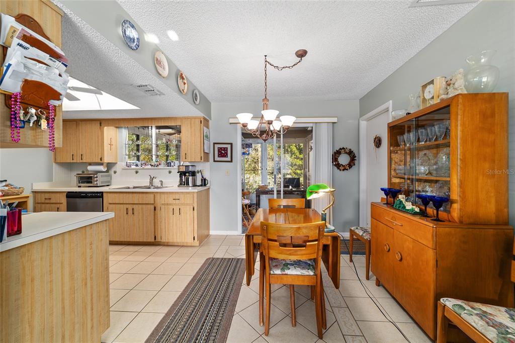 10921 Southwest 86th Court Ocala, FL 34481 - Photo 37 of 51 a kitchen that has a lot of cabinets in it and appliances