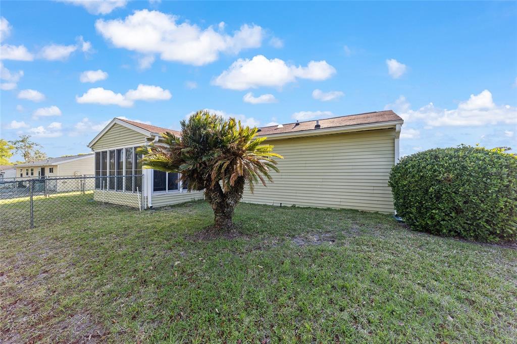 10921 Southwest 86th Court Ocala, FL 34481 - Photo 44 of 51 a view of a house with a yard