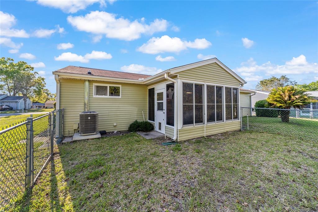 10921 Southwest 86th Court Ocala, FL 34481 - Photo 47 of 51 a view of a house with a yard