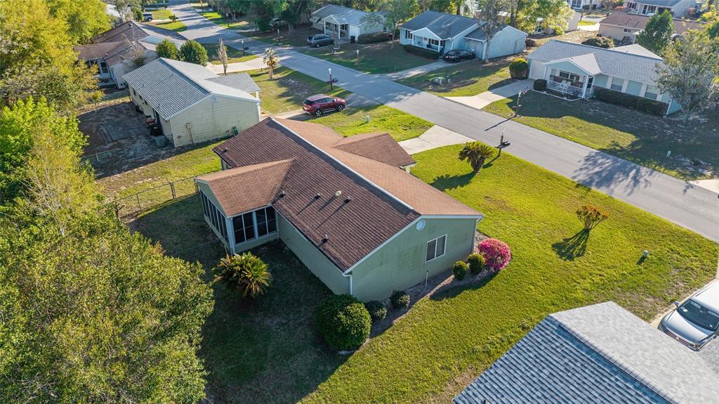 10921 Southwest 86th Court Ocala, FL 34481 - Photo 7 of 51 an aerial view of a house with a swimming pool yard and outdoor seating