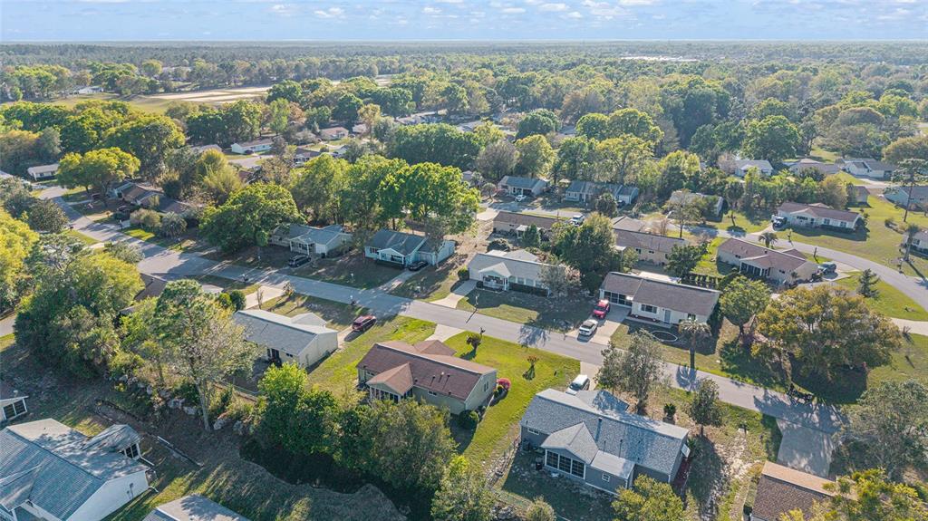 10921 Southwest 86th Court Ocala, FL 34481 - Photo 8 of 51 an aerial view of a city with lots of residential buildings