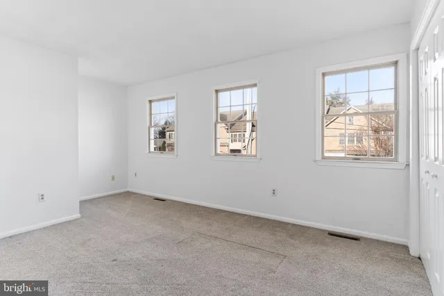 an empty room with windows