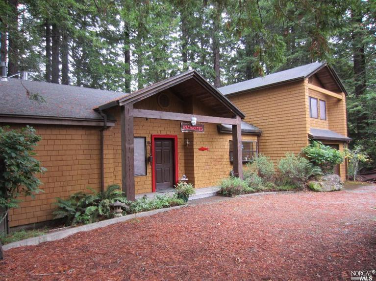 46401 Fish Rock Road Gualala, CA 95445 - Photo 1 of 1 a front view of a house with garden