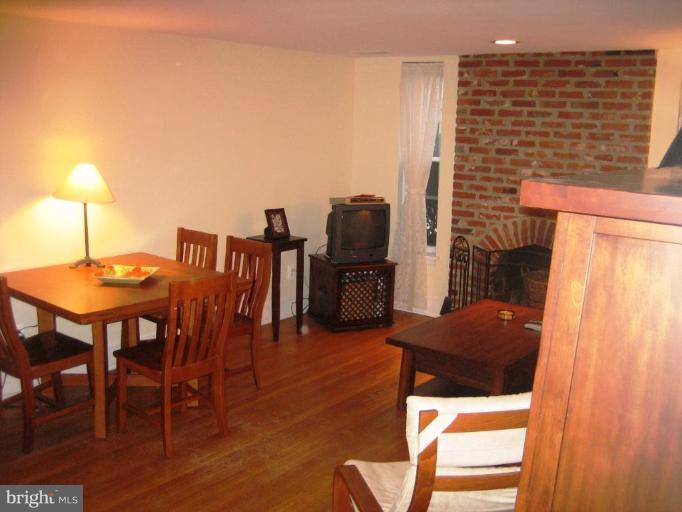 220 13th Street Southeast, Unit 5 Washington, DC 20003 - Photo 5 of 17 a view of a dining room with furniture and wooden floor