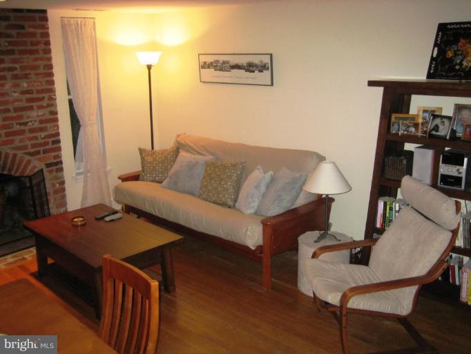 220 13th Street Southeast, Unit 5 Washington, DC 20003 - Photo 6 of 17 a living room with furniture and wooden floor