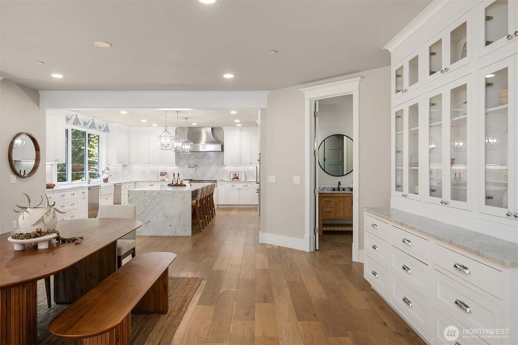 23403 Northeast Union Hill Road Redmond, WA 98053 - Photo 11 of 37 a living room with furniture a mirror a lamp wooden floor and a large window