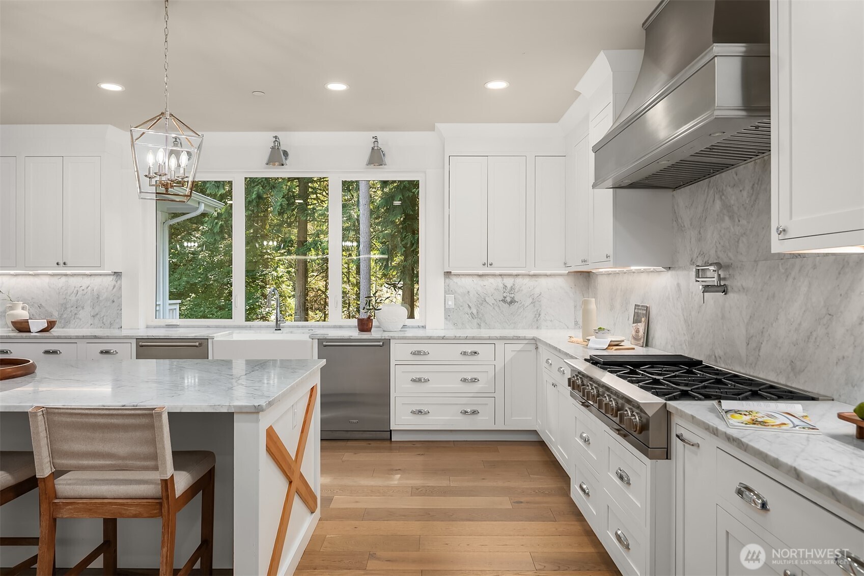 23403 Northeast Union Hill Road Redmond, WA 98053 - Photo 7 of 37 a kitchen with granite countertop a stove a sink and a refrigerator