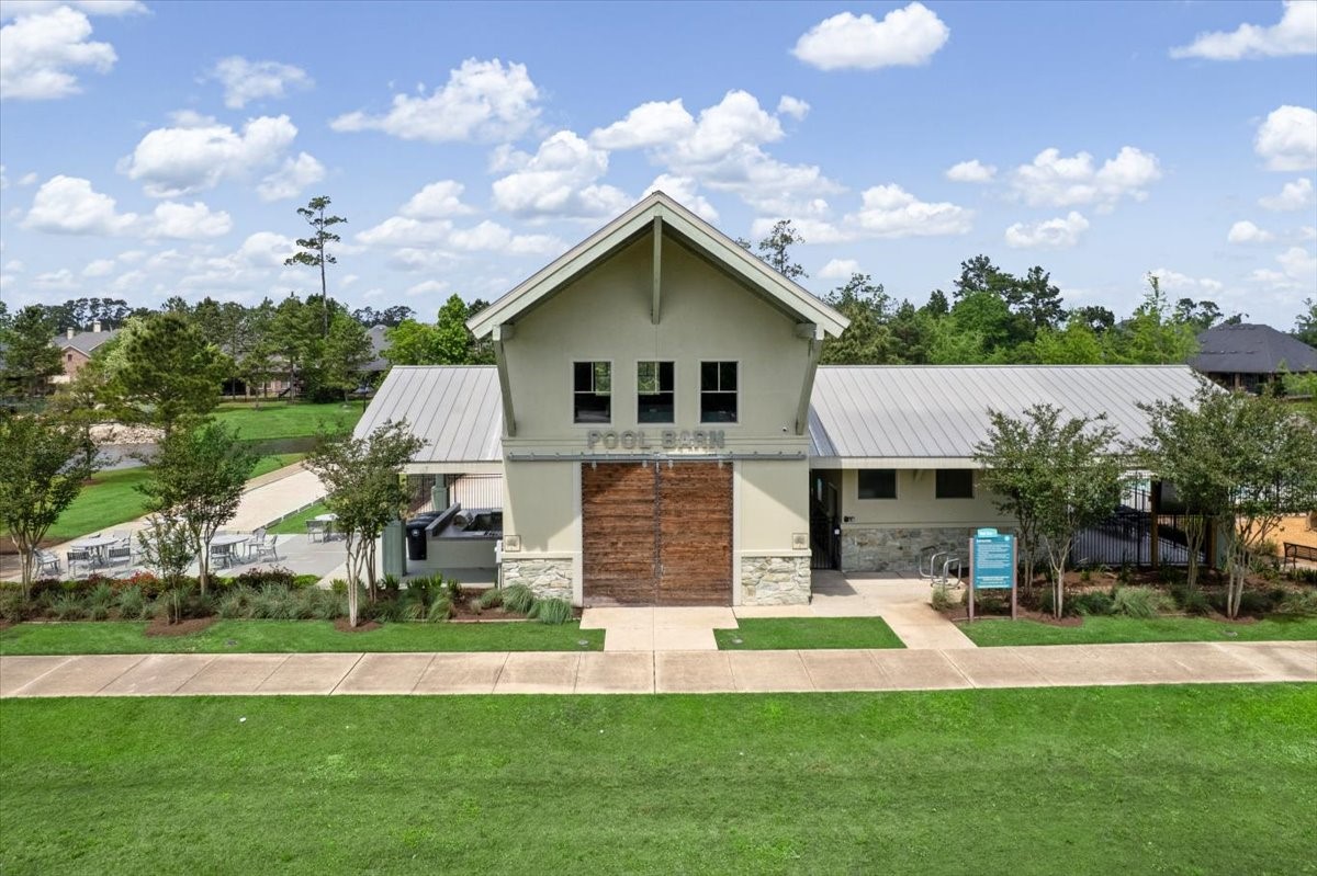 17814 Tree Of Heaven Conroe, TX 77385 - Photo 35 of 48 The West Village Recreation Center includes a community pool and pool barn with outdoor kitchen, playground, walking trails, Preserve Park, bowling, bocce ball greens and horseshoe pits. Lookout Hill, located in the central recreation area, features boulders for children to climb on and explore the environment.