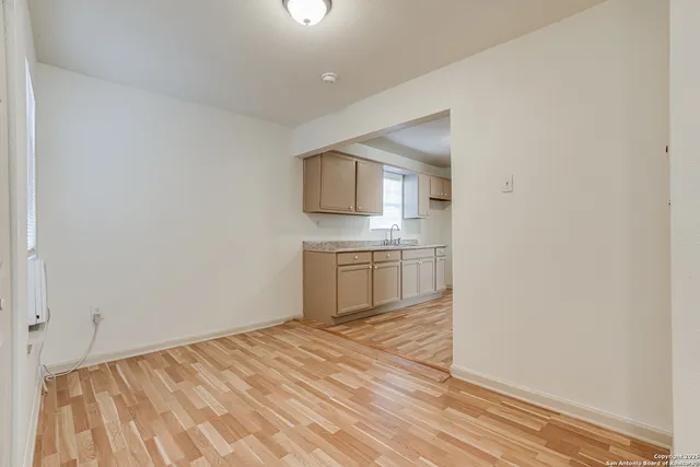 a bedroom with a bed and a sink