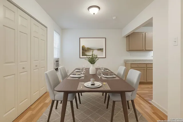 a view of a dining room with furniture and wooden floor