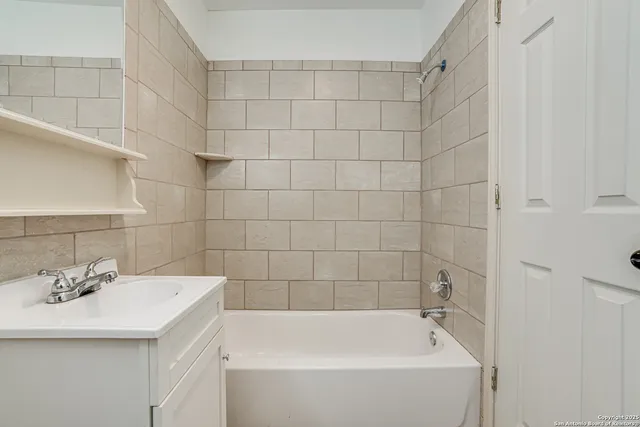 a bathroom with a sink and a bathtub