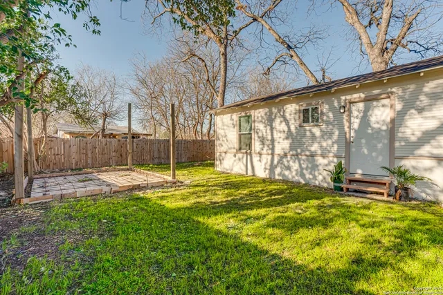 a view of yard with swimming pool
