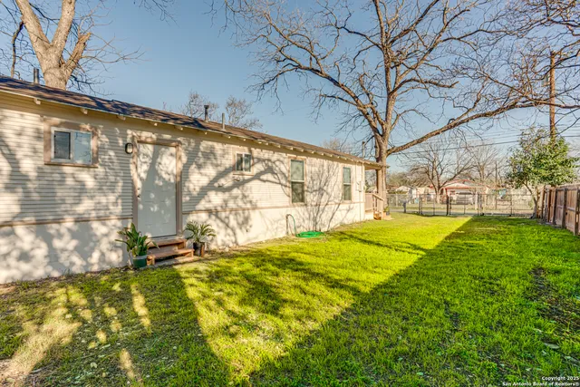 a view of swimming pool with a yard